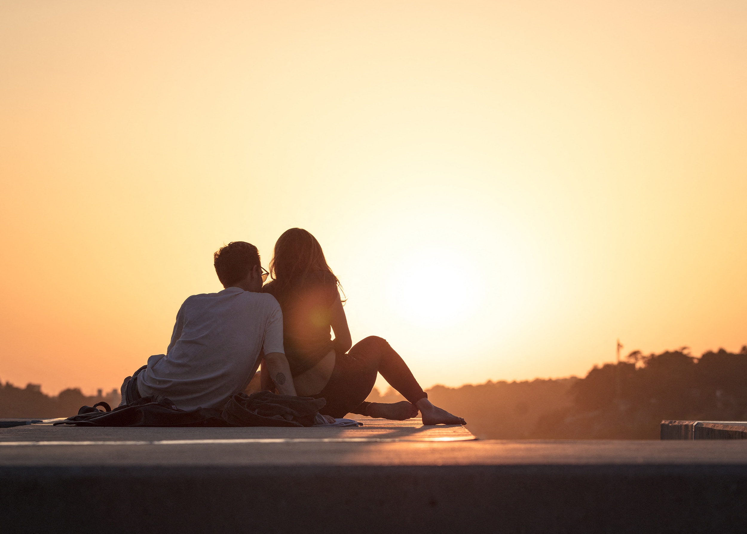 A Couple Watching at Sunset