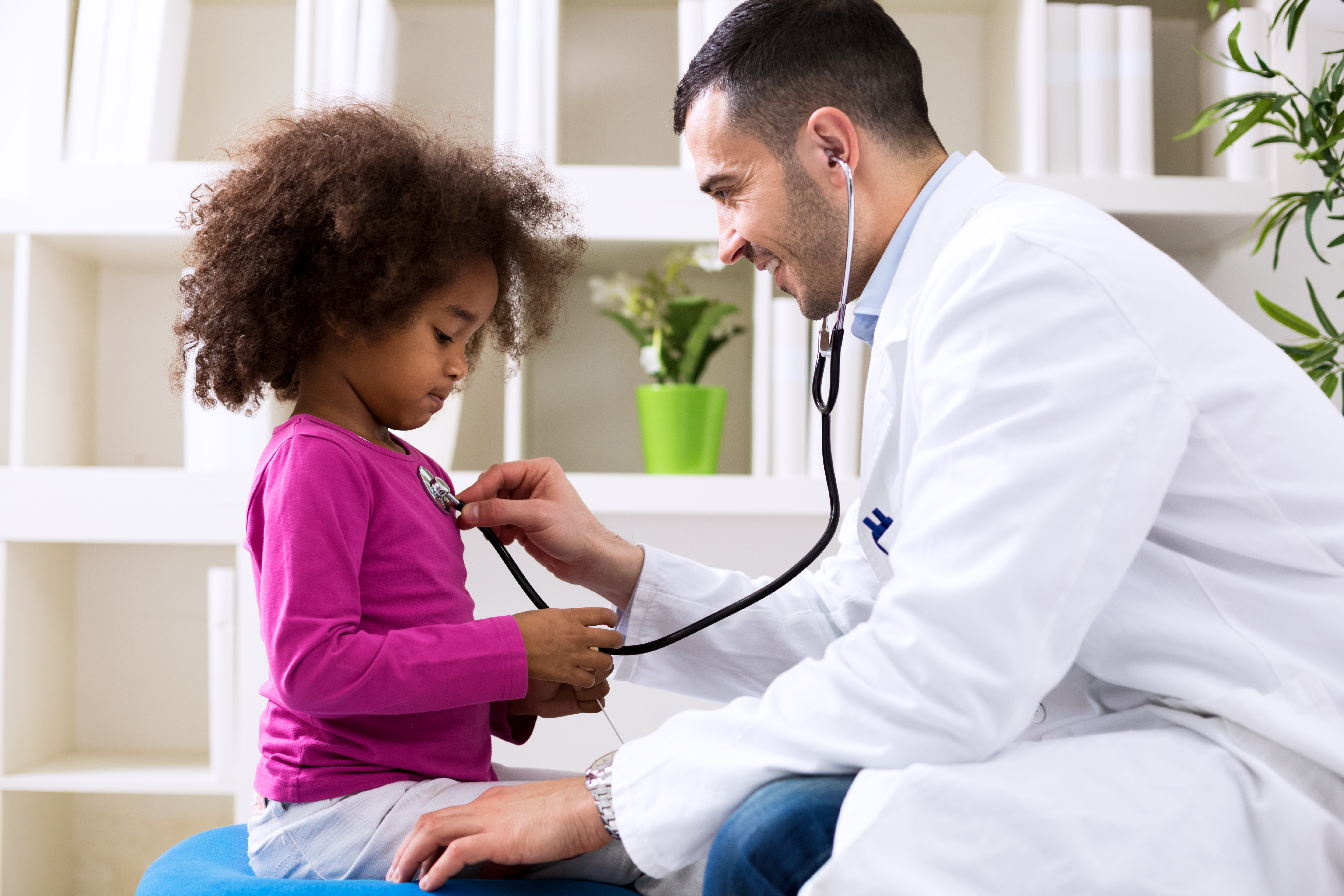 Pediatrician and little african girl