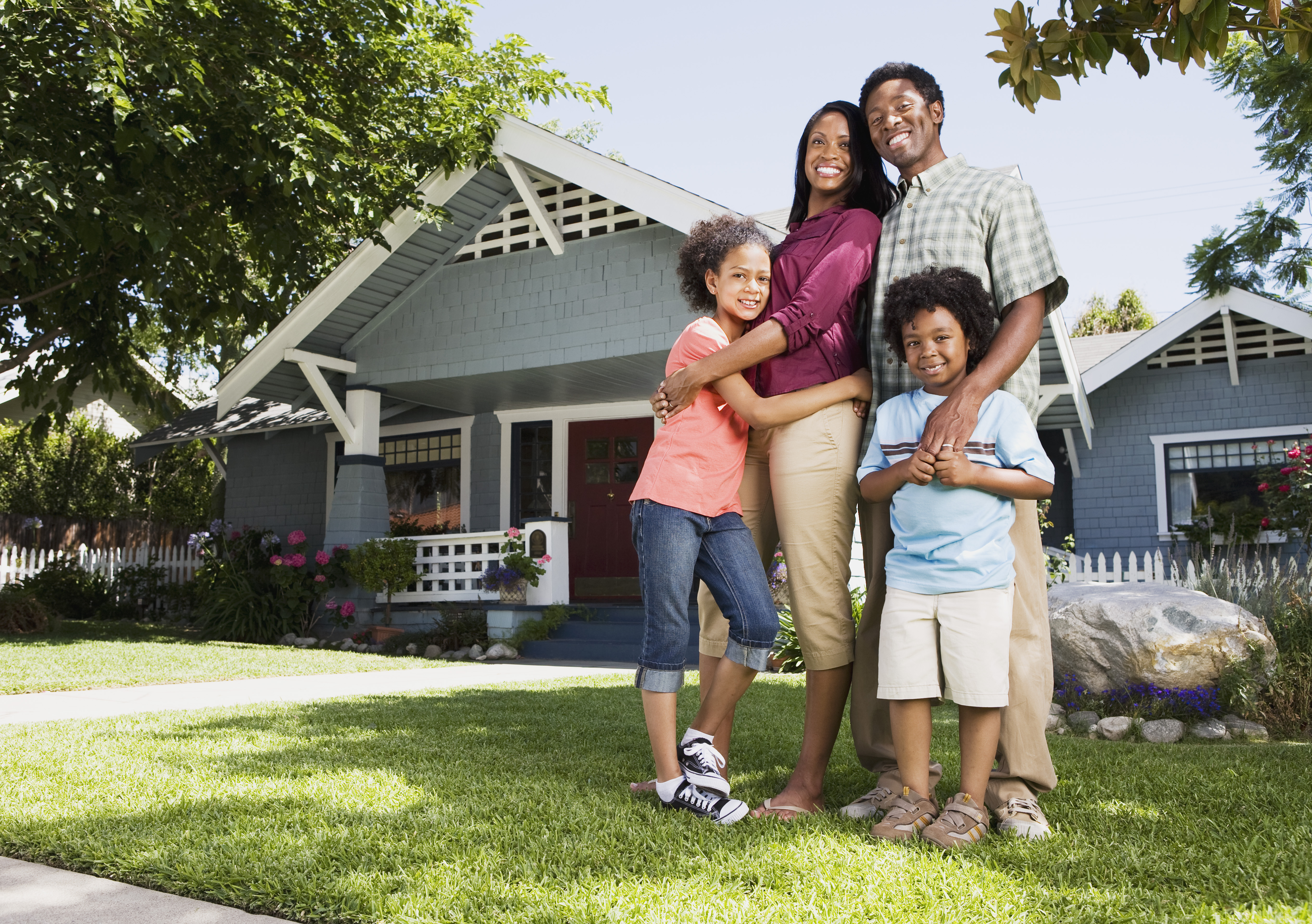 Embracing family in front of home