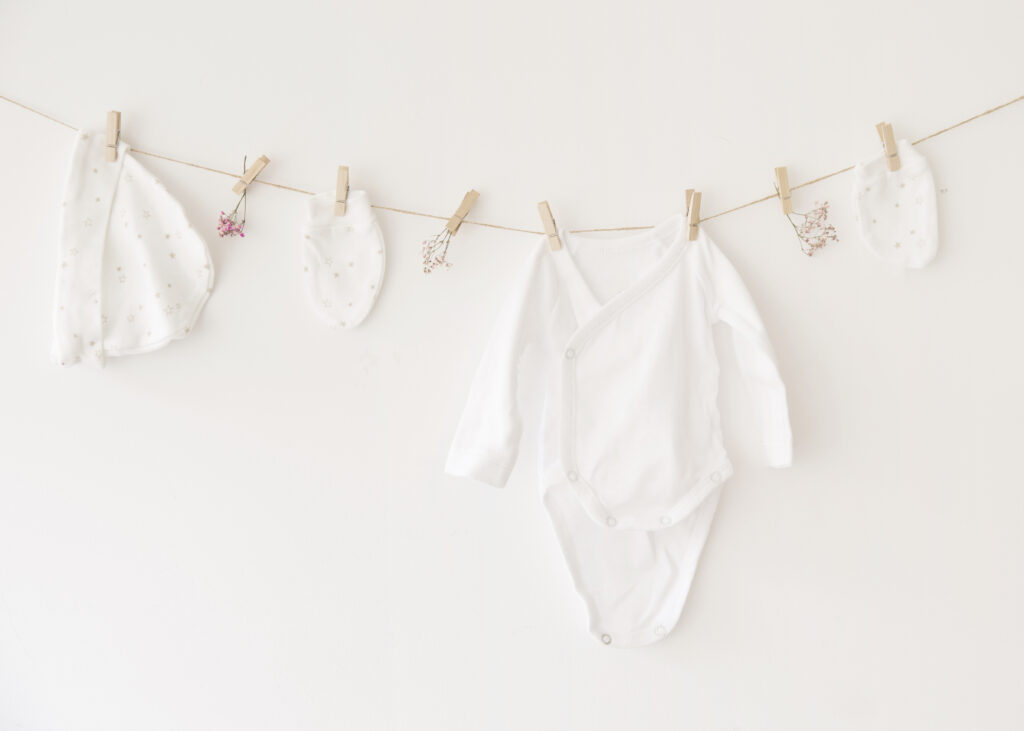 white-clothes white baby clothes clipped on a clothes drying wire